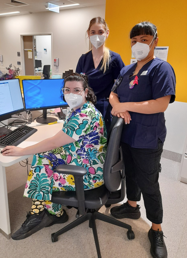 Team of nurses at desk ready to begin online traning
