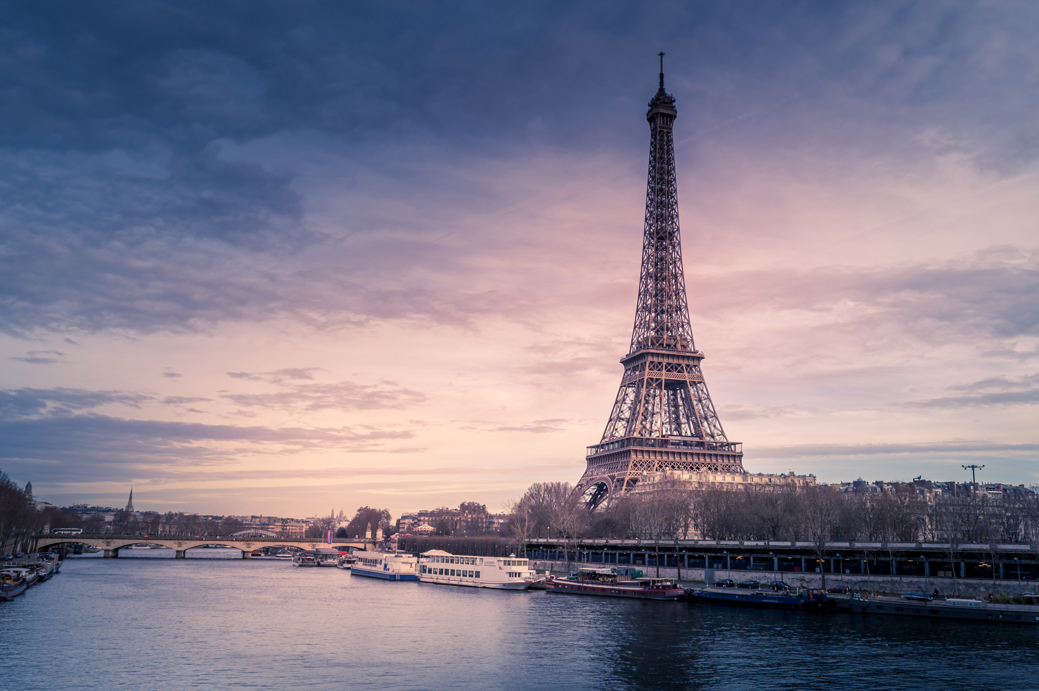 Eiffel Tower with river in foreground