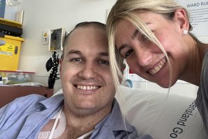Aplastic aneamia patient and bone marrow transplant recipient Sam Sheehan pictured in hospital. Alongside him is his partner Hannah.
