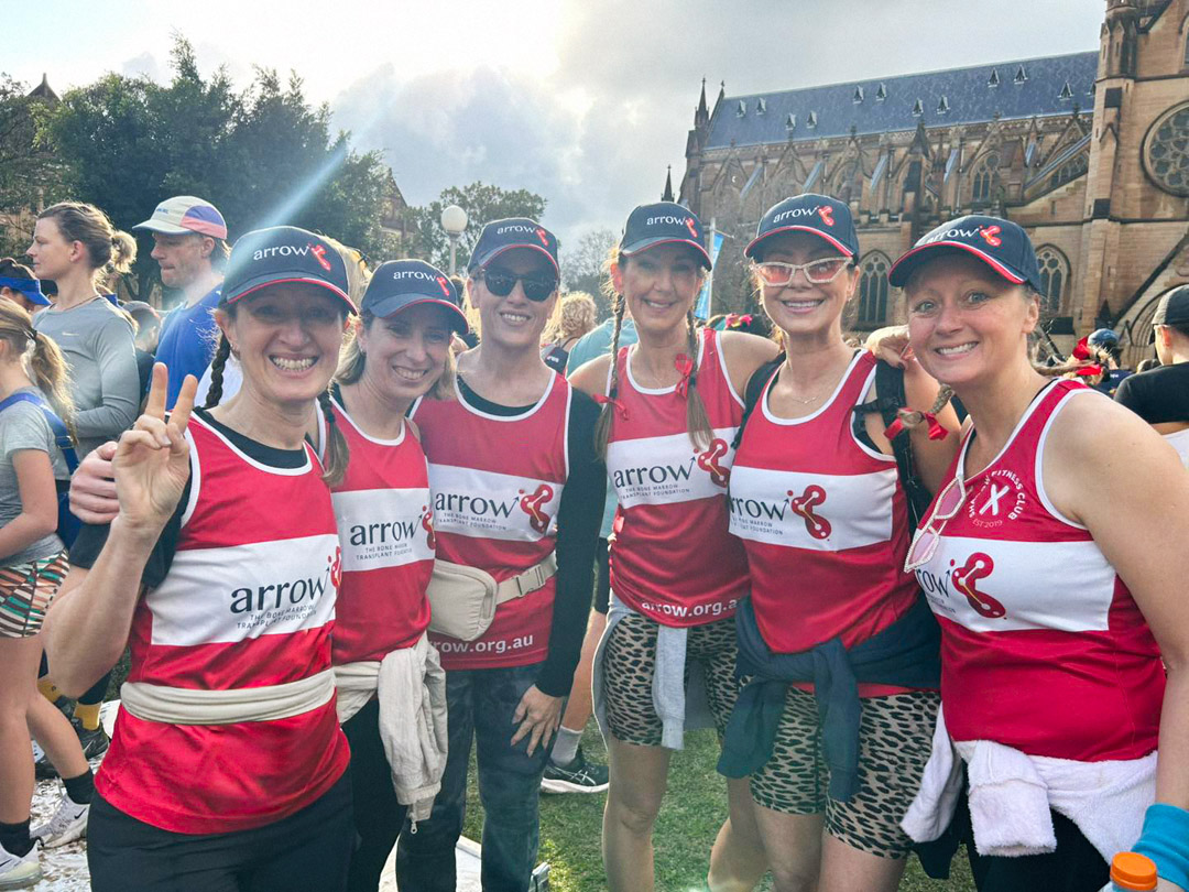 Run Sydney Marathon 2026 with Team Arrow. Pictured here are runners from the 2025 City2Surf, all wearing Arrow running vests and Arrow caps